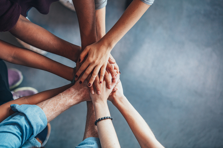 hands-in-group-huddle